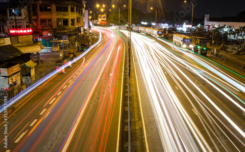 Light trails of vehicles in a street at night in Colombo Sri Lanka © tilancmb