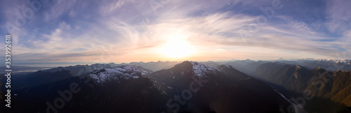 Aerial Panoramic View of Canadian Mountain Landscape during a colorful sunset. Located North of Vancouver, British Columbia, Canada. Nature Background Panorama
