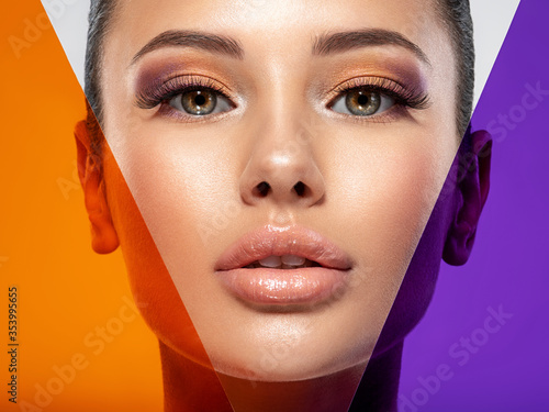 Beautiful white girl with bright eye-makeup. Beautiful fashion woman with  a colored  items.   Glamour fashion model with bright gloss make-up posing at studio. Stylish fashionable concept. Art.