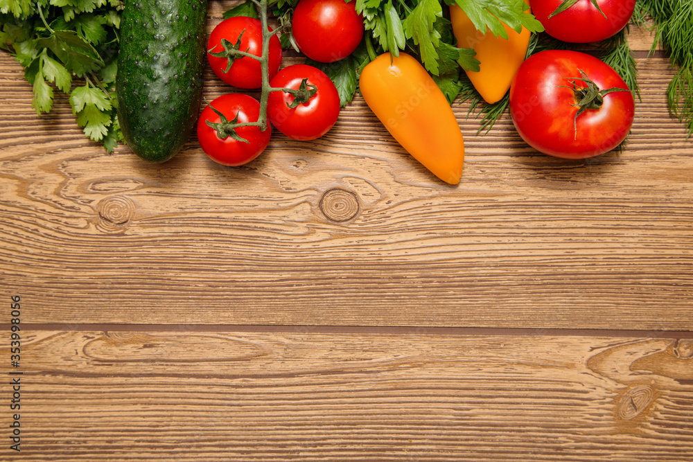 ripe raw vegetables on a wooden board. View from above. space for text ripe raw vegetables on a wooden board. View from above. space for text