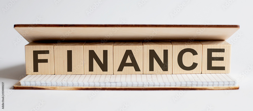 Innovation word wood block FINANCE on table for business concept. Innovation word wood block FINANCE on table for business concept.
