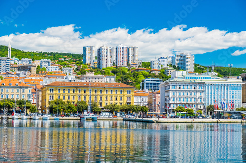 Waterfront view of the city of Rijeka, Croatia. Boats in marina and old classic monumental buildings in background. photo