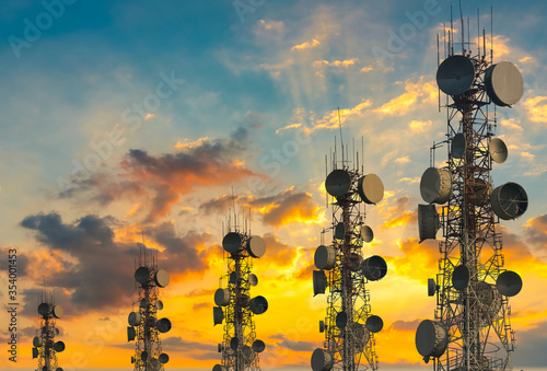telecommunication tower at sunset sky background