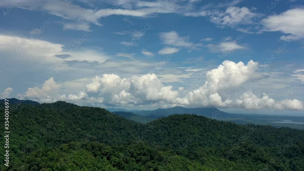 Cumulus clouds forming above forest wilderness. Monsoon season rains above Asian jungle. Aerial hyperlapse video of weather system of rainforest Cumulus clouds forming above forest wilderness. Monsoon season rains above Asian jungle. Aerial hyperlapse video of weather system of rainforest