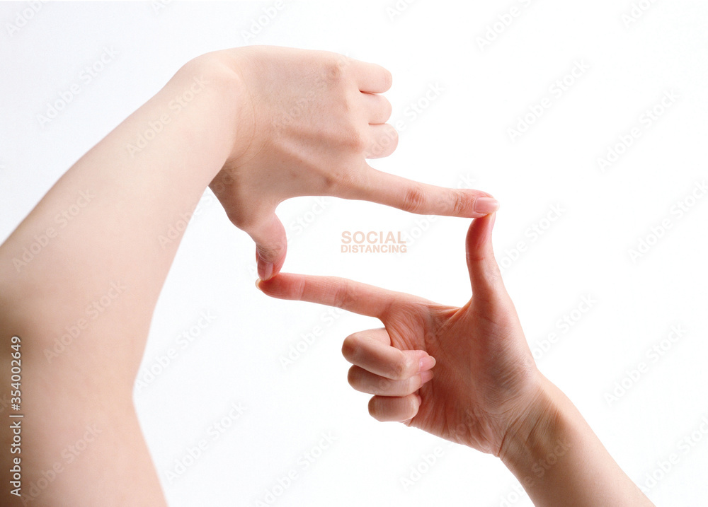 Woman’s hand gesture to show symbolic of social distance. Woman’s hand gesture to show symbolic of social distance.