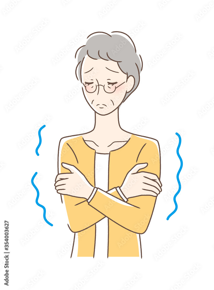 寒気を感じて震える女性 寒気を感じて震える女性
