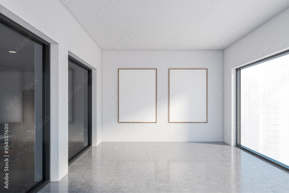 Two vertical posters in white office hall Two vertical posters in white office hall