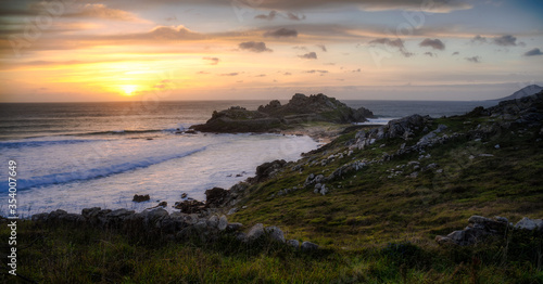 Ruins of Castro de Baroña during a beautiful sunset in the coast of Galicia
