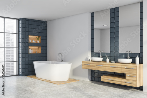 White and grey tile bathroom corner  sink and tub