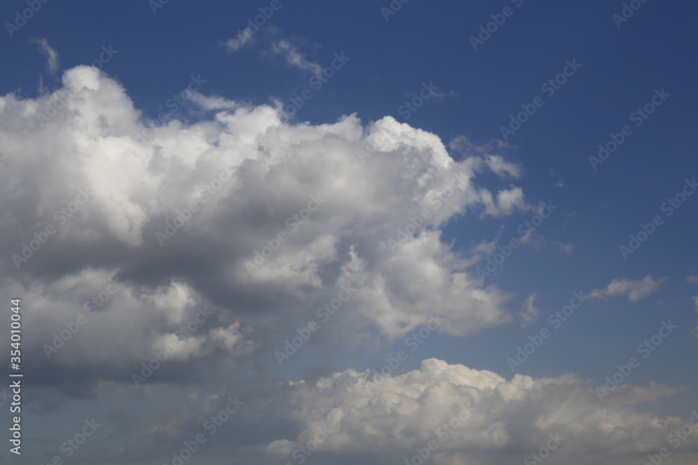 white fluffy clouds in the blue sky. white fluffy clouds in the blue sky.