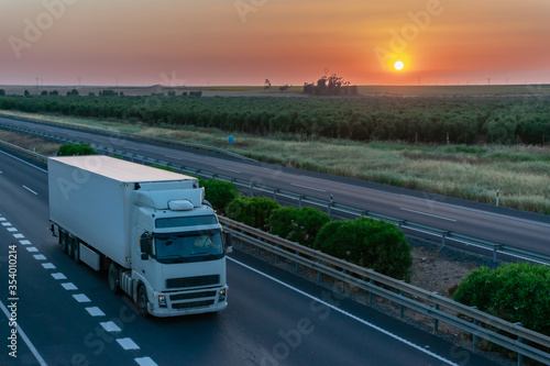 Truck with refrigerated semi-trailer to transport perishable products on the highway