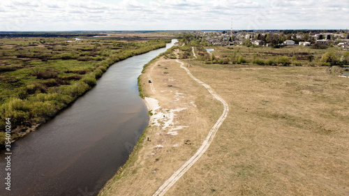 View from the drone on the river Styr  in the background the village of Zarichne. Sunny spring day. Ukraine  Europe