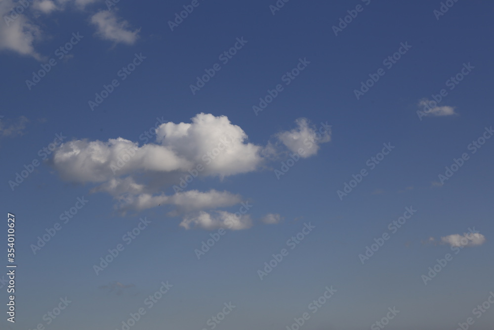 white fluffy clouds in the blue sky. white fluffy clouds in the blue sky.