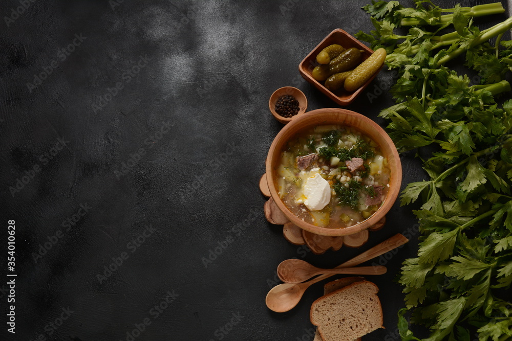 Soup with beef meat, pickled cucumbers and pearl barley.  Rassolnik- traditional Russian cuisine