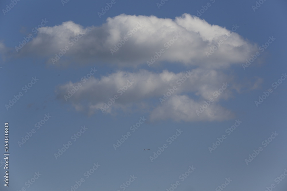 white fluffy clouds in the blue sky. white fluffy clouds in the blue sky.