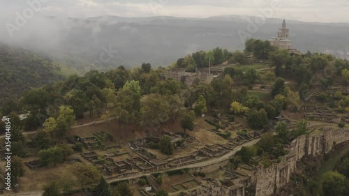 The city of Veliko Tarnovo. Top view of the famous Tsarevets fortress and mountains. Aerial footage 4k