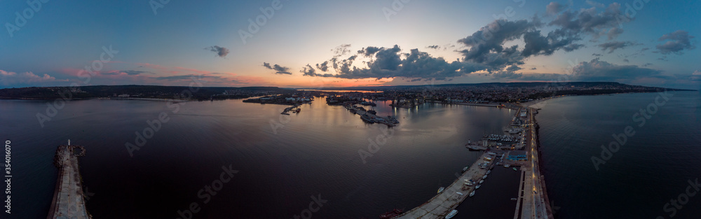 Drone Panorama of the Sea and the Varna Sea Port at sunset time with dramatic sky Drone Panorama of the Sea and the Varna Sea Port at sunset time with dramatic sky
