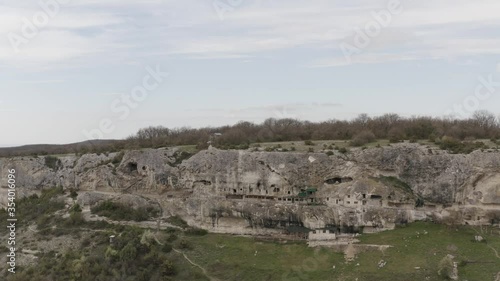 Flying drone above the cave city and monastery Chelter-Marmara, near the city of Bakhchysarai, Crimea. Aerial footage 4k