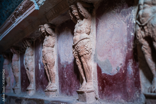 Atlantes Figures in the Tepidarium at the Forum Baths in Pompeii, a Decoration Detail in an Ancient Roman Spa called Thermae photo