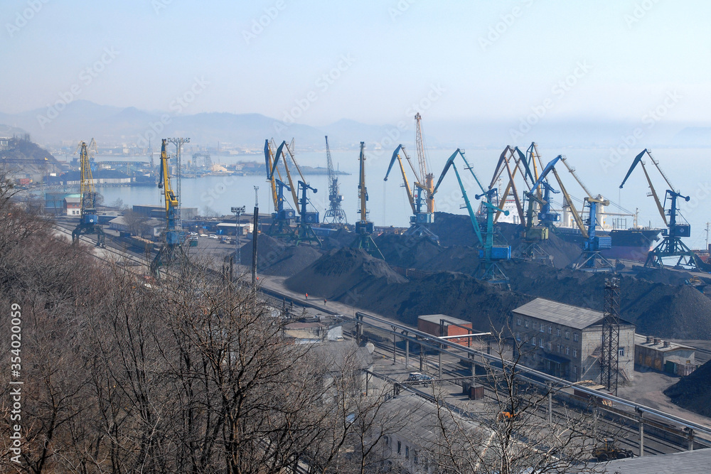 Industrial cityscape. View at Nakhodka sea port. Peter the Great Gulf, Sea of Japan, Primorsky Krai (Primorye), Far East, Russia.