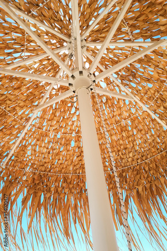 view under an umbrella made of dried palm leafs