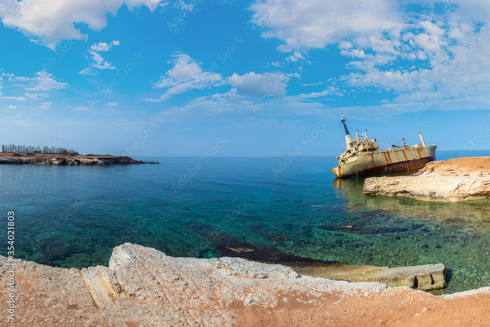 Cyprus beach.Paphos. Old ship near the shore. Sights of Paphos. Shipwrecked ship near Cyprus. Cyprus on a summer day. Bay in Mediterranean Sea. Rusty ship near the city of Paphos. Travels