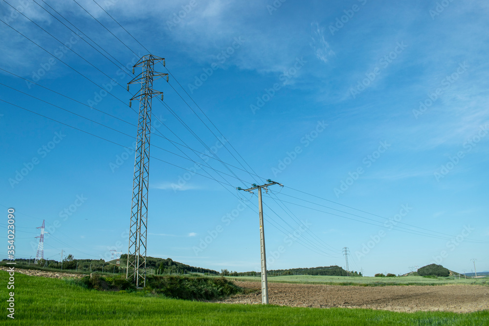 Paisaje de prados verdes en verano con tendido eléctrico. Paisaje de prados verdes en verano con tendido eléctrico.