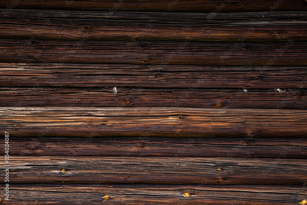 texture of the brown log wall of the house