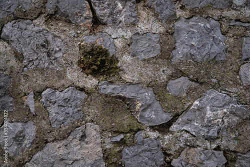 Obraz na płótnie Texture of stone wall made of grey stones w salonie
