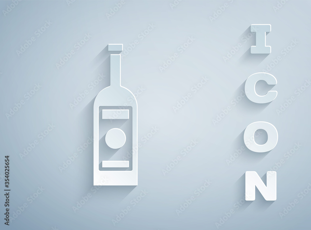 Paper cut Glass bottle of vodka icon isolated on grey background. Paper art style. Vector Illustration. Paper cut Glass bottle of vodka icon isolated on grey background. Paper art style. Vector Illustration.