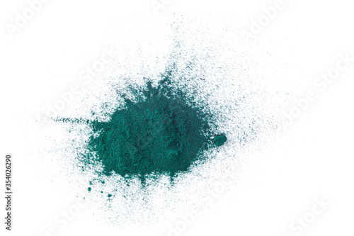 Splash of spirulina algae powder isolated on a white background. Superfood concept. Top view.
