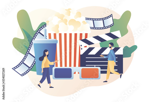 Online cinema. Mobile movie theater. Cinematography. Tiny people watching movie with popcorn,3d glasses and video attributes. Modern flat cartoon style. Vector illustration on white background
