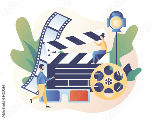 Online cinema concept. Mobile movie theater. Tiny people watching movie with popcorn,3d glasses and video attributes. Cinematography. Modern flat cartoon style. Vector illustration on white background