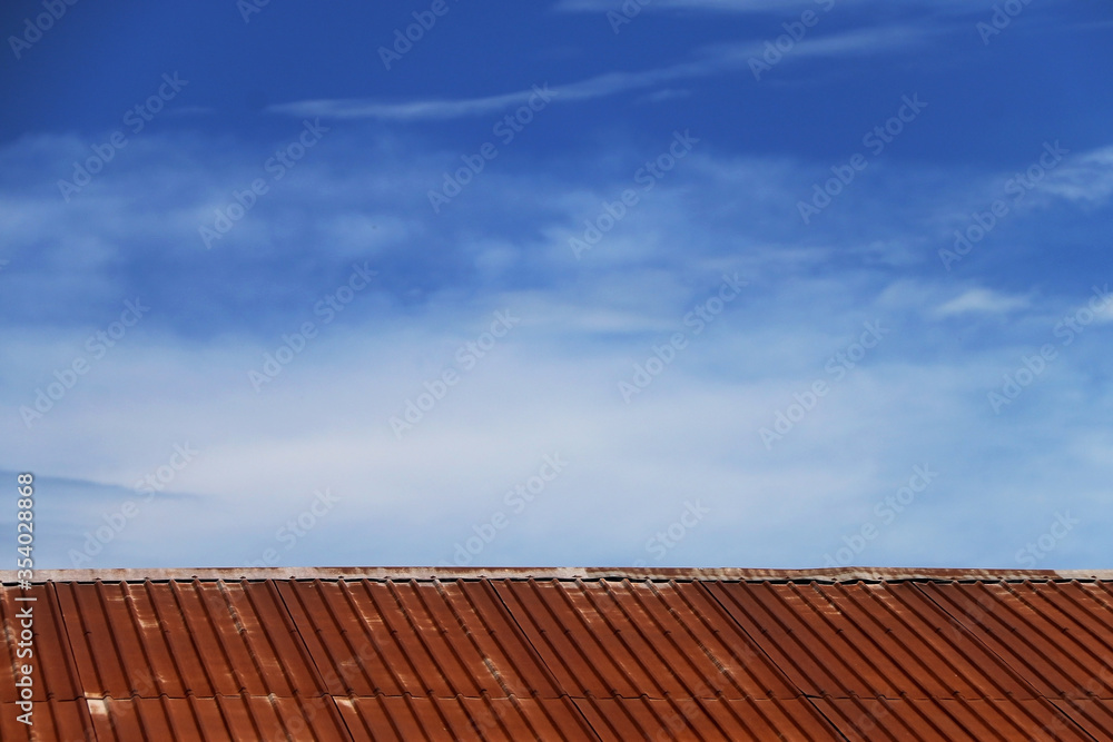 Galvanized roof old and rusty In the blue sky. Galvanized roof old and rusty In the blue sky.