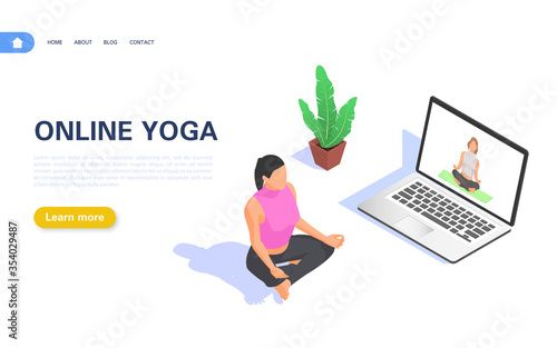 Online yoga concept. A girl practices yoga and meditation while watching a broadcast on a laptop while staying at home.
