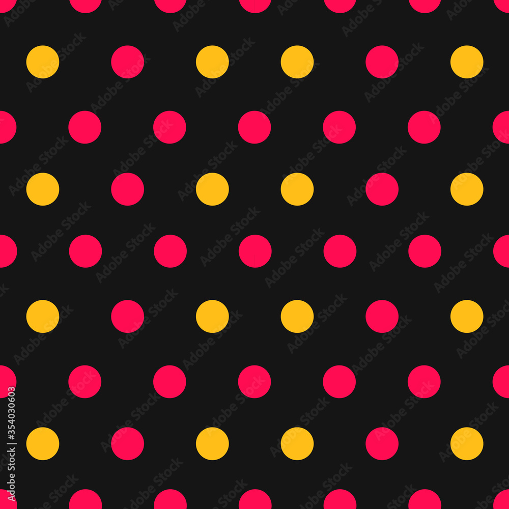 Pink and yellow polka dots on black background seamless pattern.
