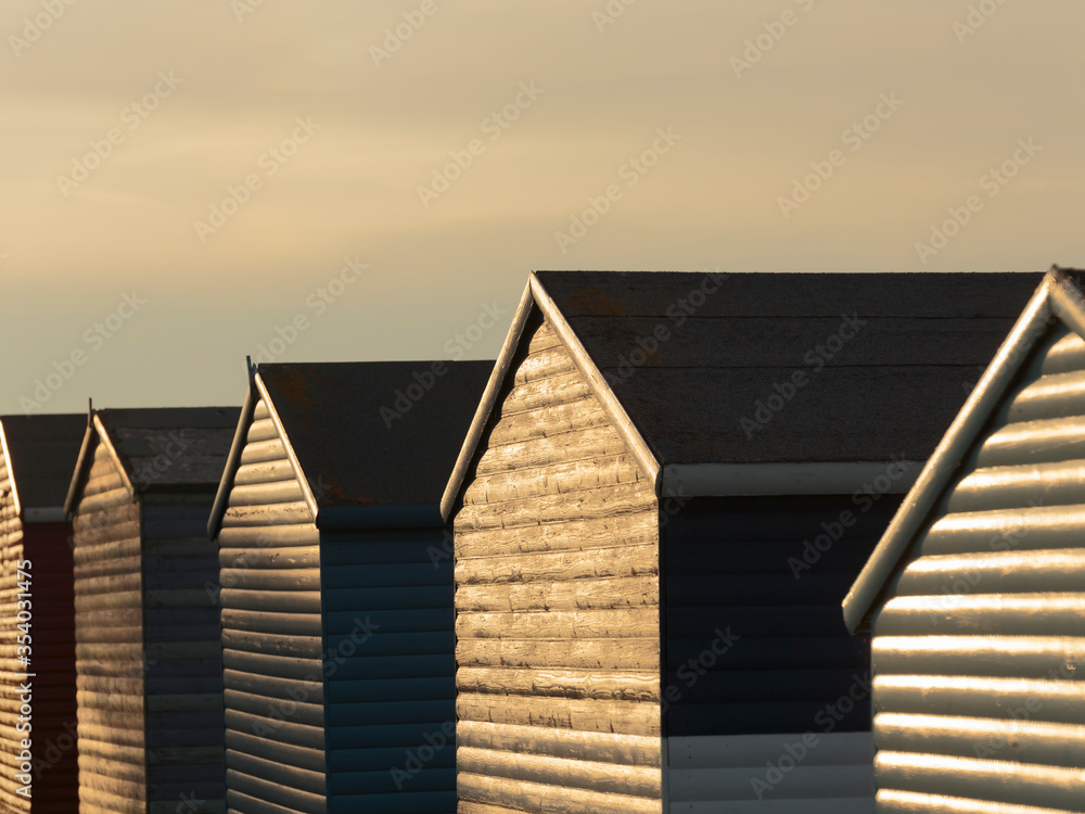Sunset over beach houses on Tankerton Beach, Whitstable, England