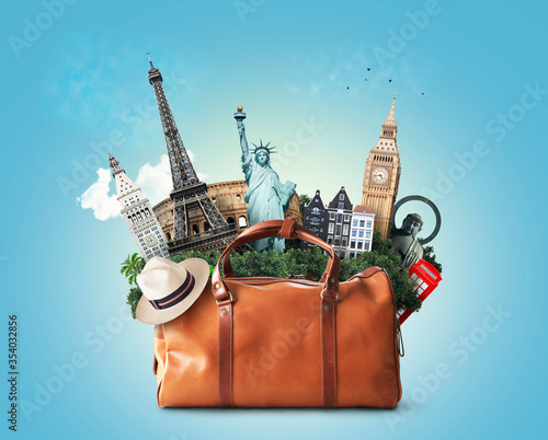 Photography Travel concept, large classic brown leather travel bag with landmarks