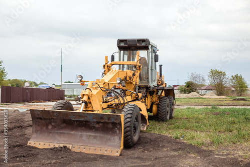 Yellow bulldozer with bucket. Wheel Loader. Heavy Equipment Machine. Tractor Front Loader. Construction Machinery.