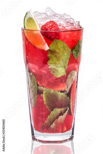 A glass of Mojito Raspberry Cocktail with lime and mint photo