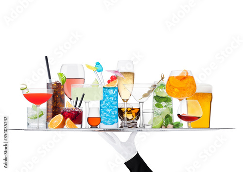 Batler waiter wearing white glove tray with various cocktails with ice isolated on white.Blue lagoon, martini, negroni, mojito, spritz, gimlet, cuba libre, cosmopolitan, margarita.