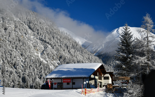 House in snow-crowded the mountains.