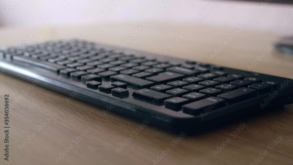 Spraying antiseptic on keyboard - cleaning from virus and bacteria slow motion Spraying antiseptic on keyboard - cleaning from virus and bacteria slow motion