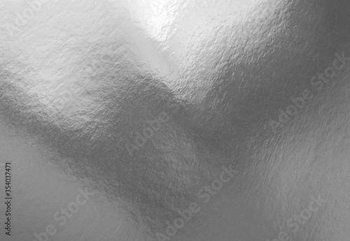 Silver foil texture background with shadows and highlights