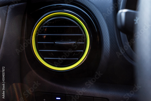 Air intake with a yellow ring interior of a car
