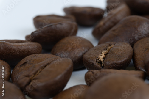 Large coffee beans isolated on a white background close-up