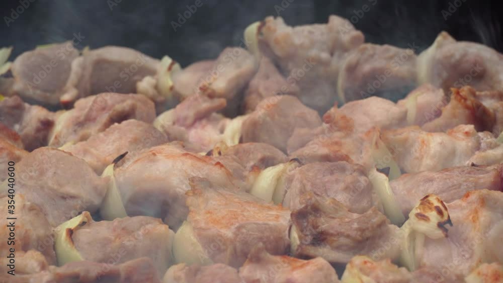 barbecue closeup, meat roasted on the fire, the pork is marinated shish kebab, delicious food
barbecue closeup, meat roasted on the fire, the pork is marinated shish kebab, delicious food