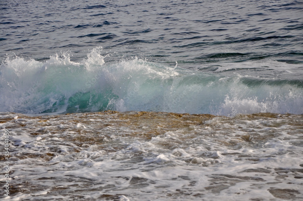 waves on the rocks splashing croatian coast waves on the rocks splashing croatian coast