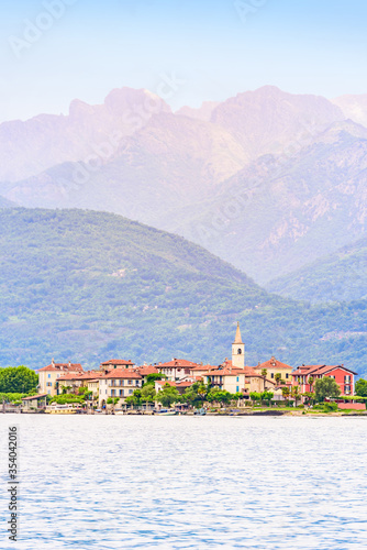 Isola dei Pescatori - fisherman island in Maggiore lake with mountains in the background, Borromean Islands (Isole Borromee), Stresa, Piedmont, Northern Italy - travel destination in Europe. photo