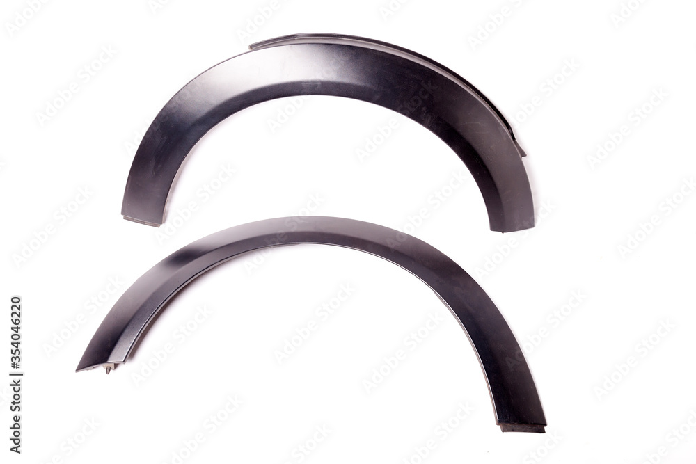 A pair of black plastic arch extensions for sale or replacement at a car service center - item for sale at an auto-parsing. A pair of black plastic arch extensions for sale or replacement at a car service center - item for sale at an auto-parsing.